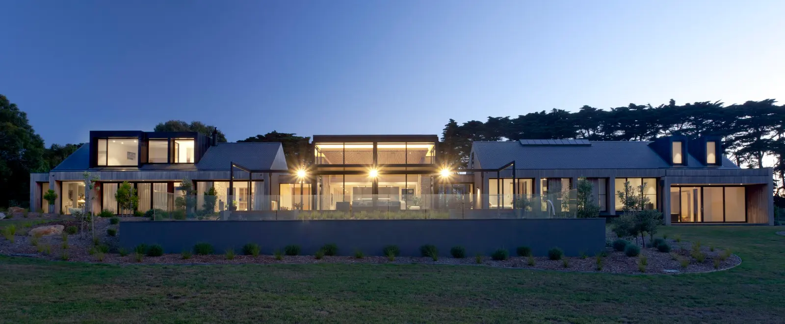 The Range, Red Hill. The house along the ridge at dusk.